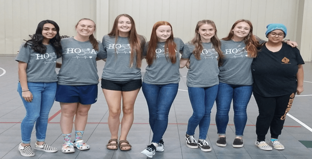 a group of HOSA Volunteers standing in a line