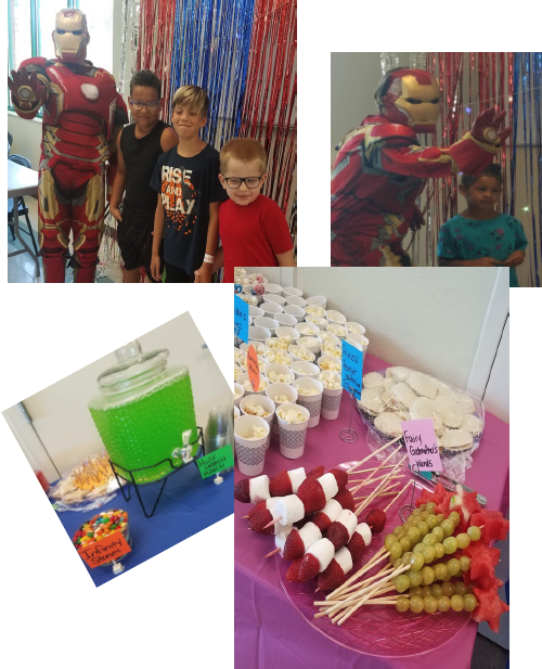 Iron Man poses with several of the resident youth. Beverages and stacks were available too.