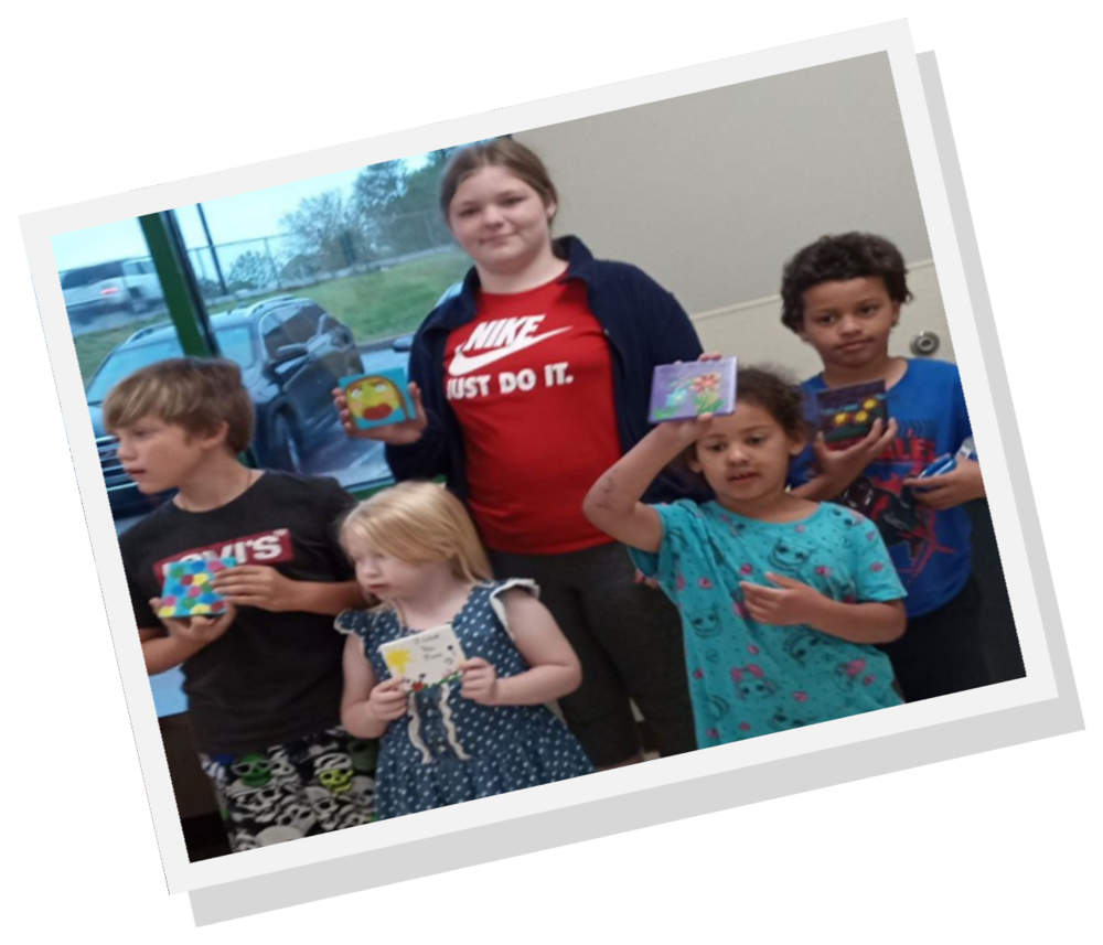 Children showing off crafts